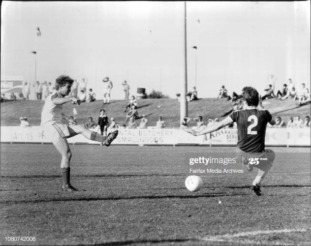 Peter Stone striking the ball during a National Soccer League match