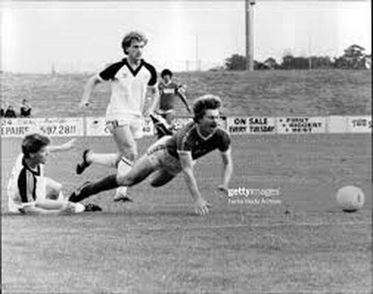 Peter Stone in a full-blooded challenge for the ball